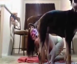 This large woman wears a mask and wants to bang a doggie